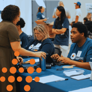 Damari helping a community member at a recent laptop event.