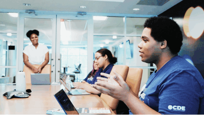 Photo of Damari at a Digital Navigator staff meeting.