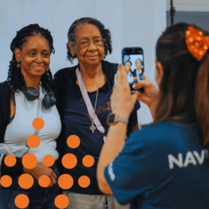 Mom and daughter pose for photo after receiving their laptops.