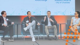 Photo of CDE Executive Director, Bruce, moderating a panel discussion at the Tech Rising Summit.